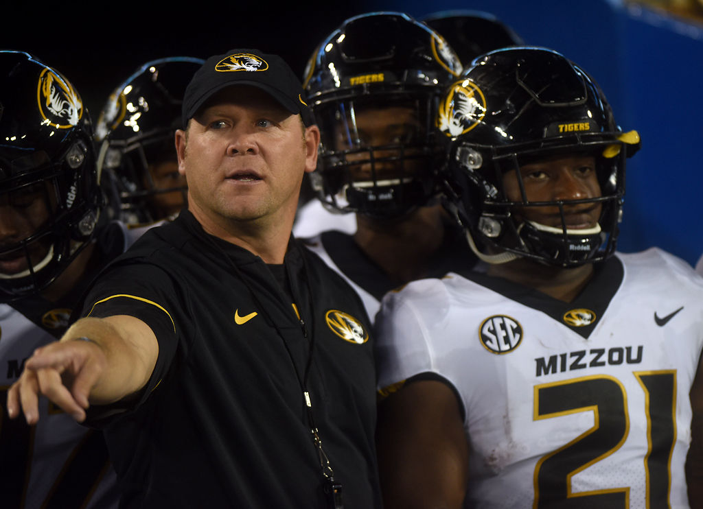 Barry Odom directs his players